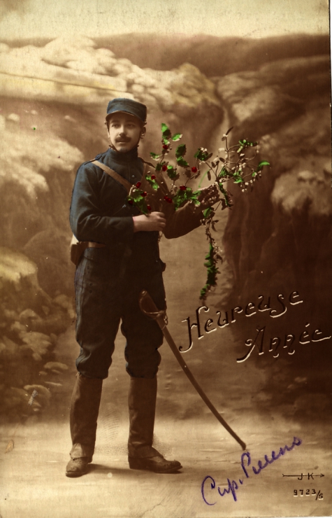 Beeld- en postzijde nieuwjaarskaart, soldaat met hulst- en maretak, 1915