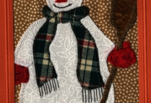 Beeldzijde kerst- en nieuwjaarskaart, sneeuwpop in patchwork